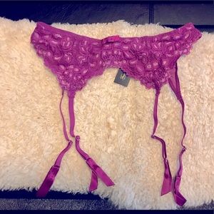 Fredricks of Hollywood purple garter belt